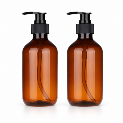 Two empty amber bottles with black pumps
