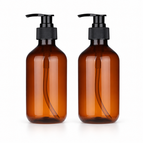 Two empty amber bottles with black pumps
