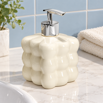 Ivory ceramic dispenser on a bathroom vanity