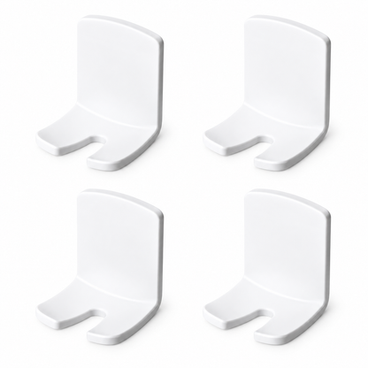 Four empty white adhesive toothbrush holders